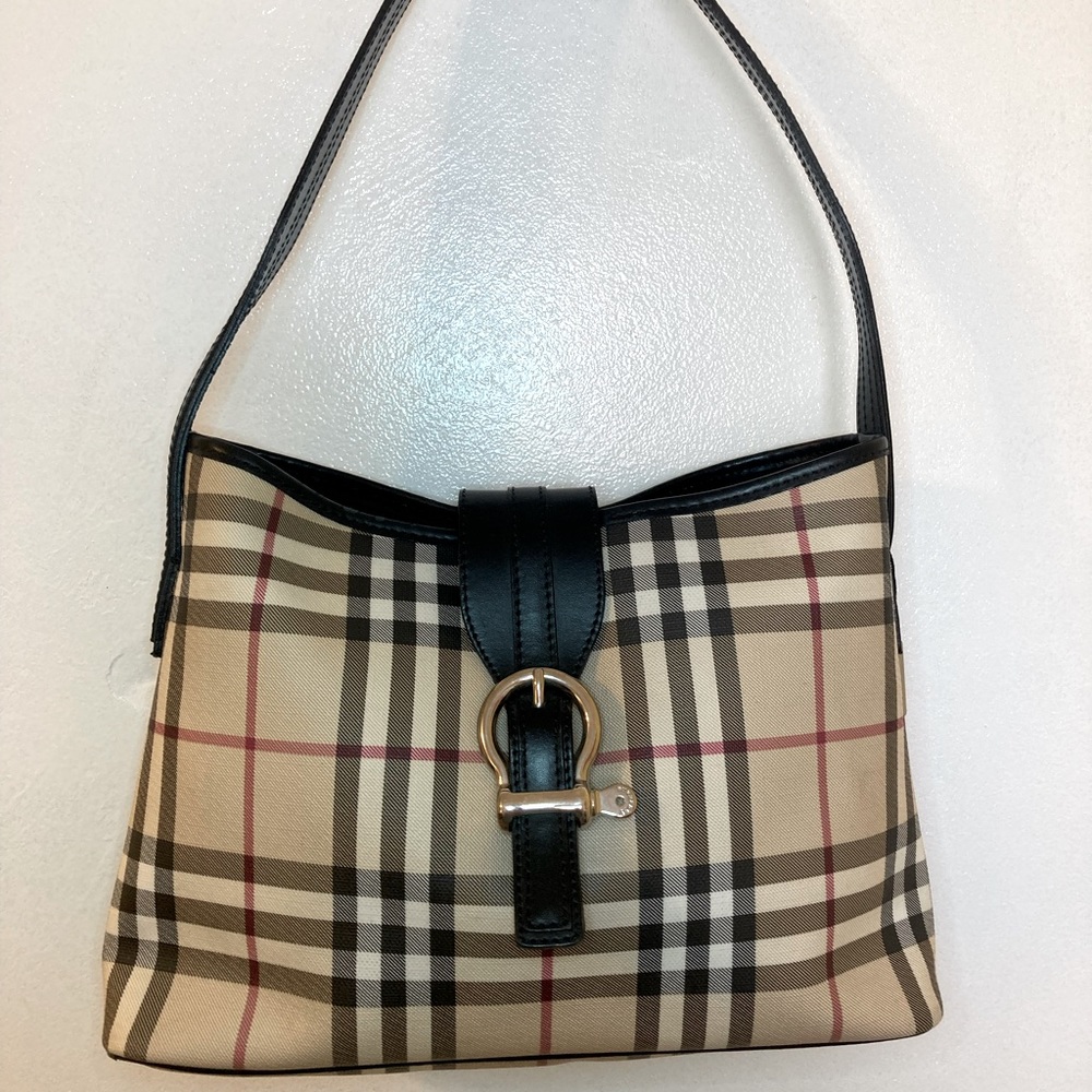 Small Burberry shoulder bag 17x11x3. Excellent condition. Dust bag included.